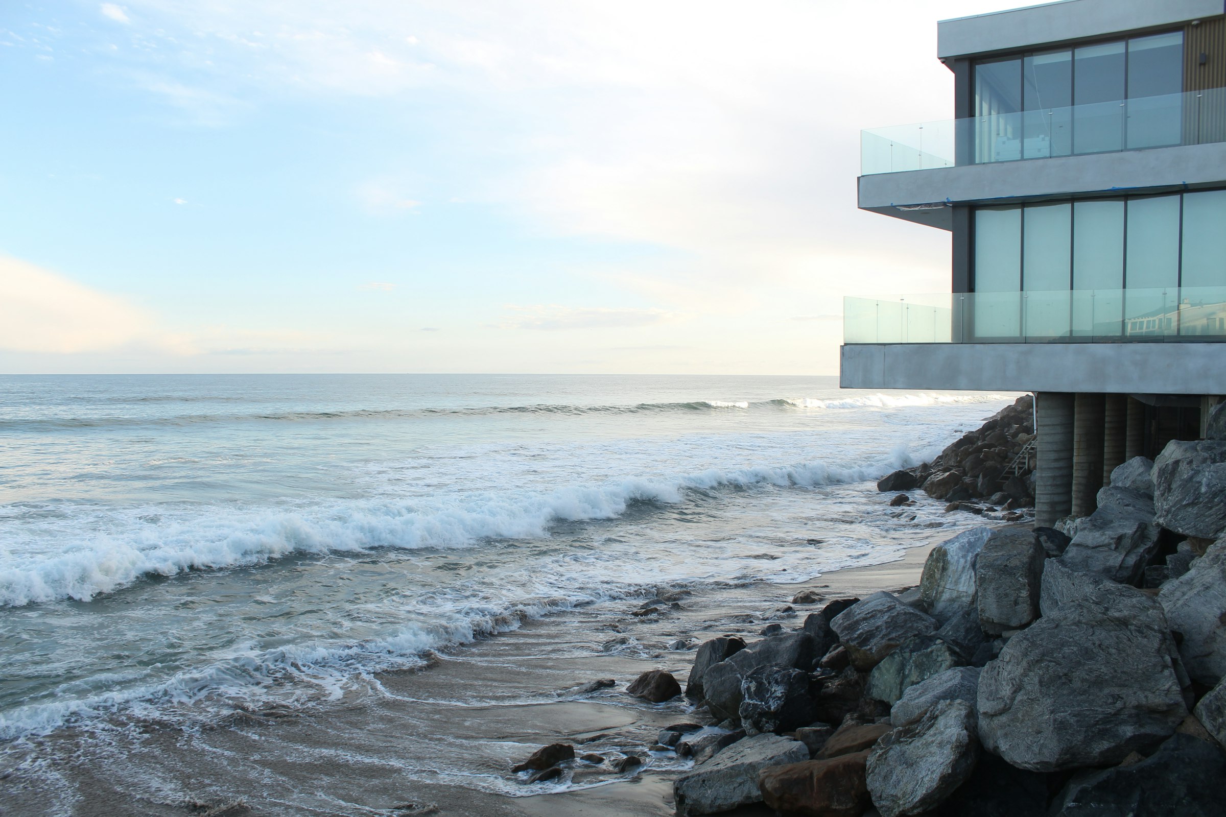 A refined coastal residence immersed in early-morning light